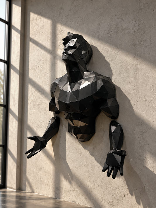 Emerging Man 3D geometric metal wall sculpture by Metart Atelier on a concrete wall.