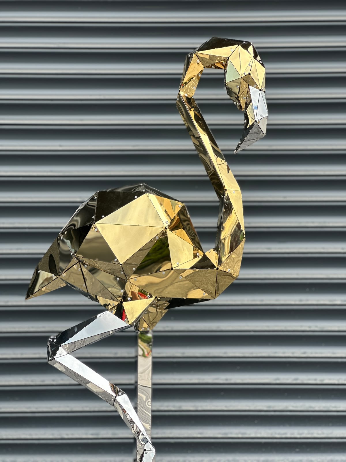 Luxury gold and silver geometric flamingo sculpture with a polished mirrored finish