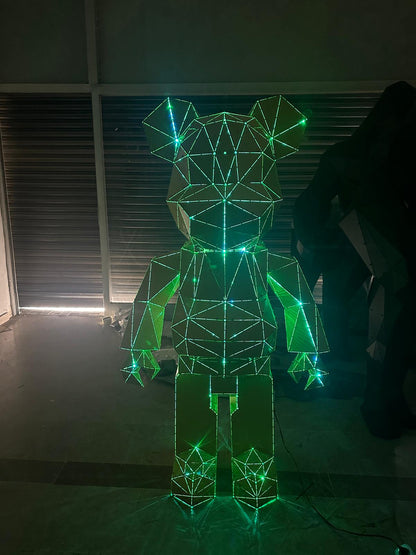 Geometric bear sculpture made of metal wires illuminated with glowing green lights