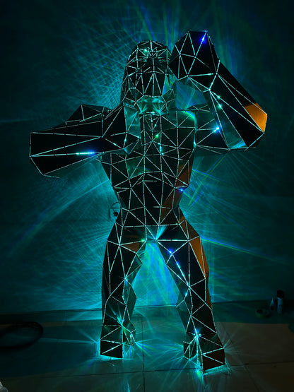 Geometric wireframe gorilla sculpture illuminated by blue and yellow LED lights