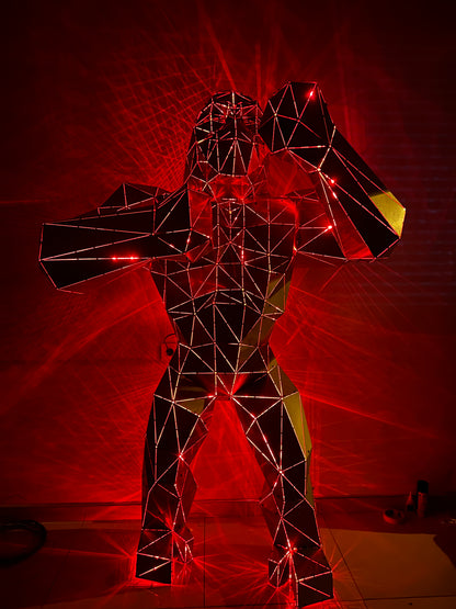 Geometric wireframe gorilla sculpture illuminated by red laser lights