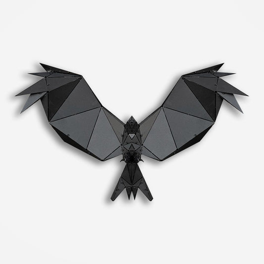 Handcrafted black metal geometric bird sculpture with spread wings on a white background