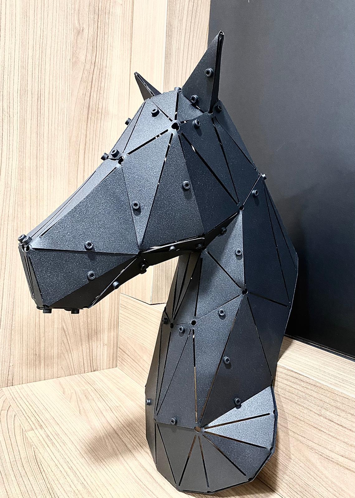 Handcrafted black metal horse head sculpture with a geometric low-poly design.