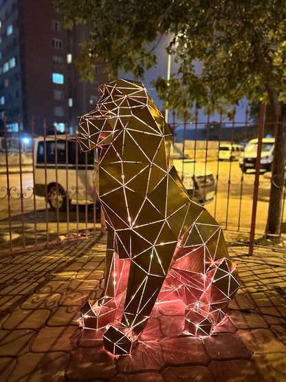 Handcrafted geometric metal lion sculpture with integrated lighting on a paved patio