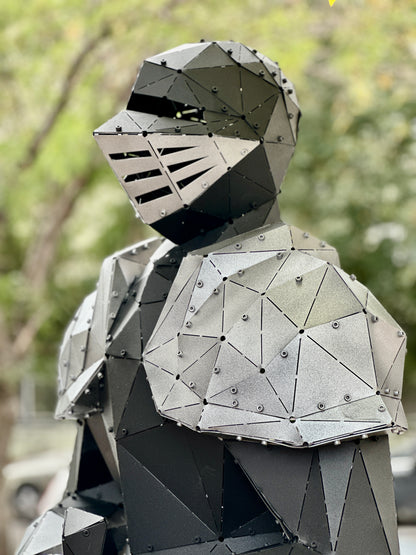 Handcrafted low-poly metal sculpture of a humanoid figure in armor