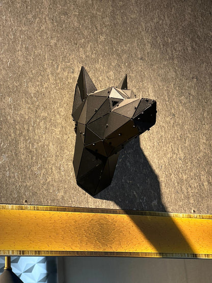 Low-poly black metal Doberman head wall sculpture mounted on a textured grey wall