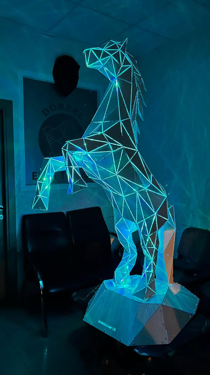 Low-poly geometric horse sculpture with integrated blue LED lighting on a pedestal