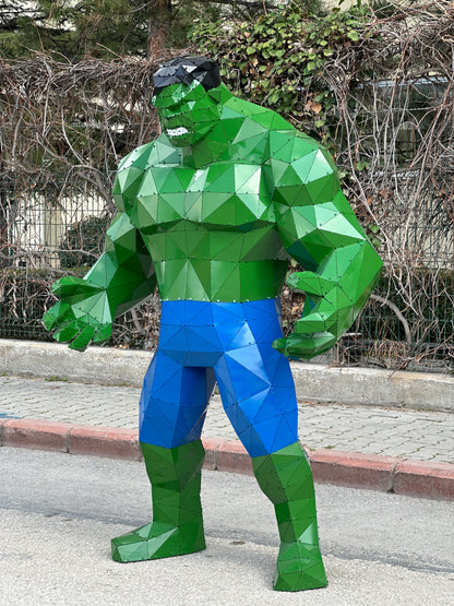 Low-poly metal sculpture of the Hulk in green and blue, handcrafted from geometric plates.