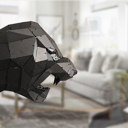 Low-poly handcrafted black metal panther sculpture in a modern living room setting