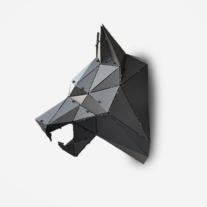 Low-poly handcrafted black metal wolf head sculpture on a white background