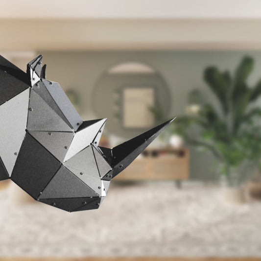 Low-poly handcrafted metal rhinoceros sculpture in a blurred modern interior setting