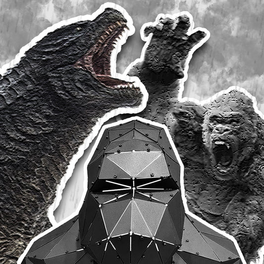 Low-poly black metal gorilla bust sculpture in front of a gorilla and giant monster artwork
