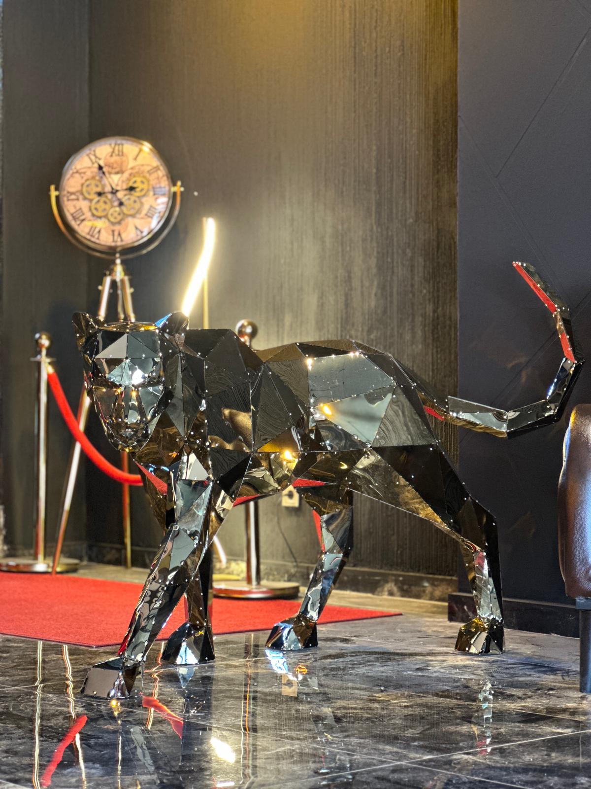 Low-poly polished metal panther sculpture in a luxury interior setting