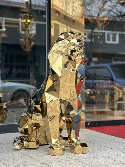 Luxury gold geometric metal sitting lion sculpture with reflective mirrored facets