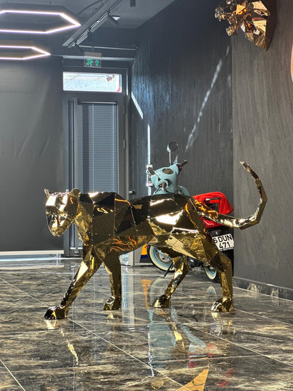 Luxury gold geometric panther sculpture in a modern interior setting