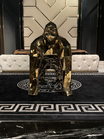 Luxury handcrafted gold geometric gorilla sculpture in a modern interior setting