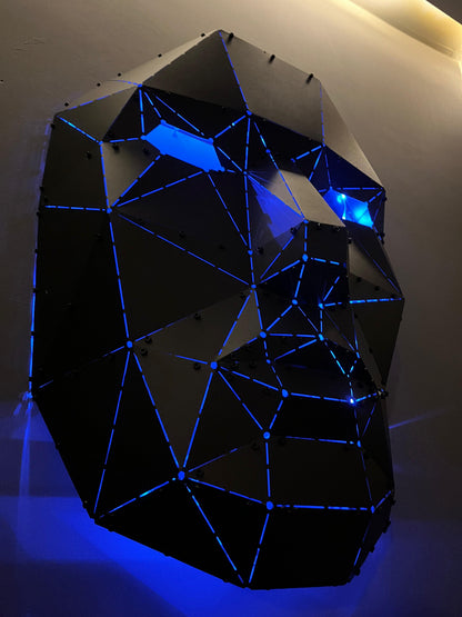 Luxury low-poly metal face sculpture with blue LED backlighting