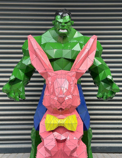 Low-poly metal sculpture of the Hulk and a pink rabbit with a yellow bowtie.
