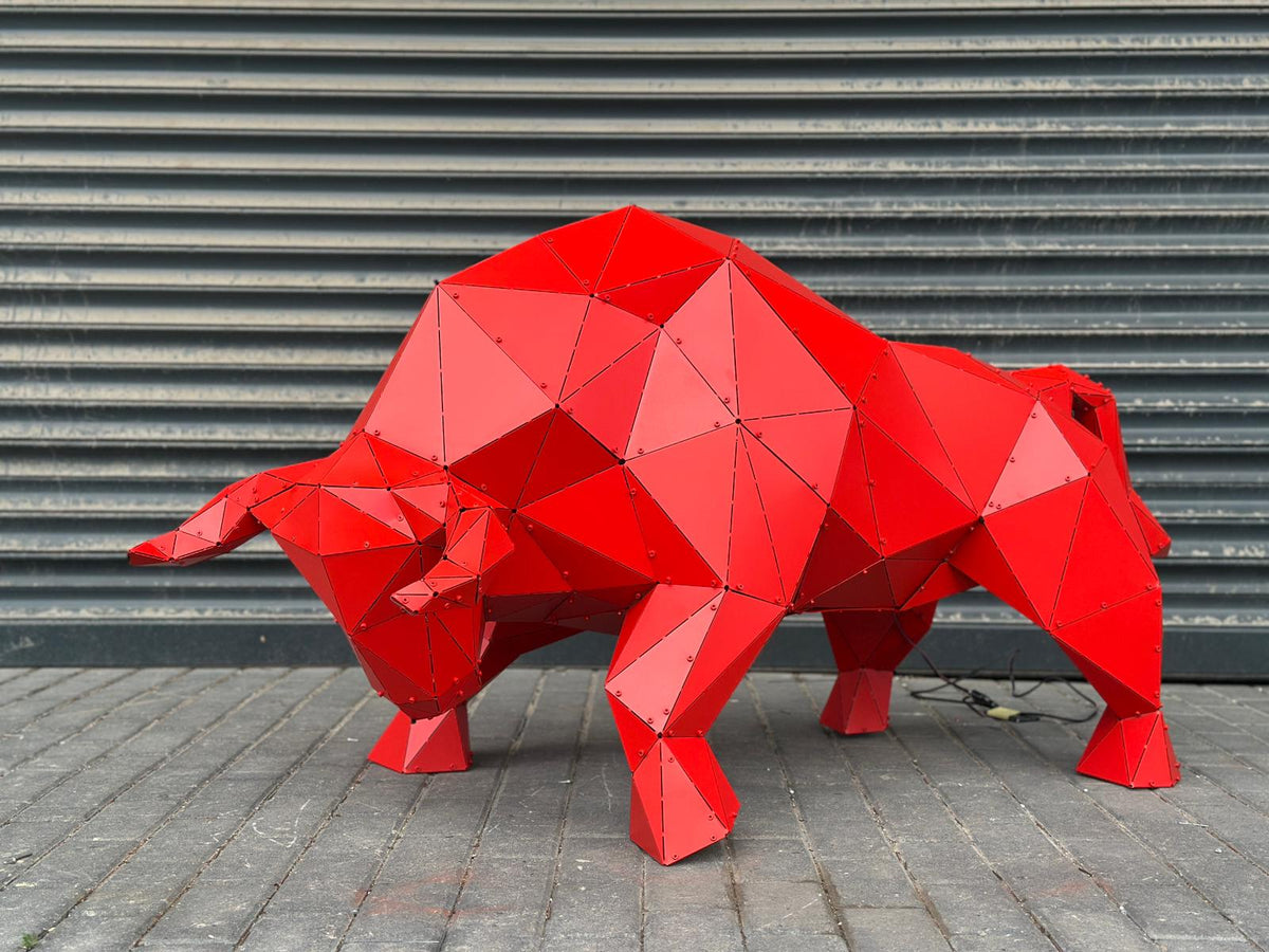 Red geometric 3D bull sculpture by Metart Atelier for outdoor and indoor garden decor.